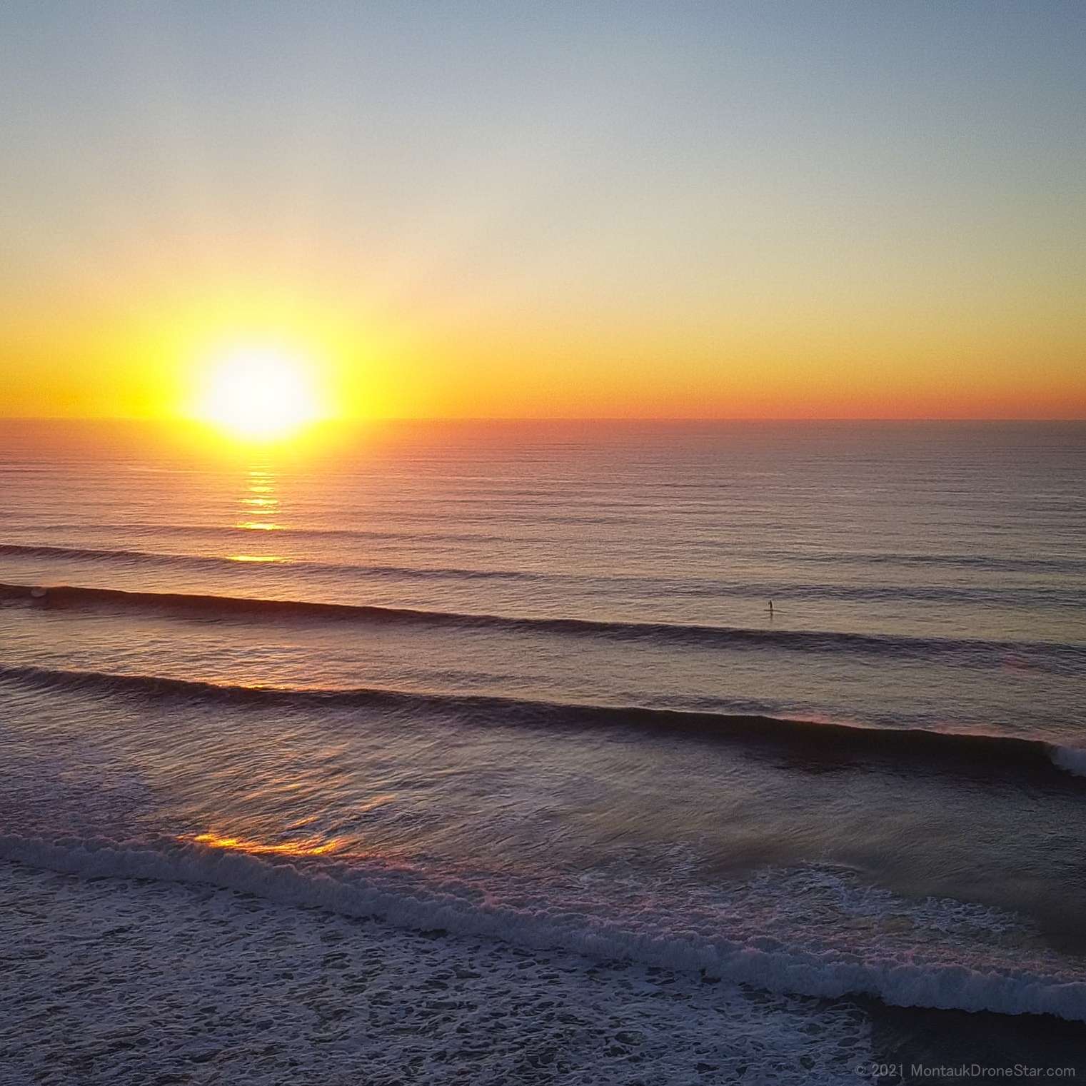 Beautiful Sunrise over the surf breaking at Ditch Plains Beach, a favorite hangout of Montauk surfers for generations